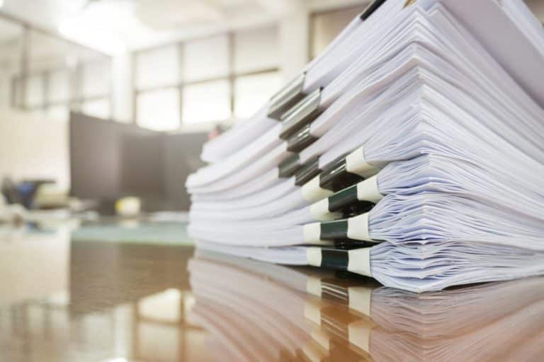 Pile of documents on desk — Linda Emery & Associates in Gosford, NSW