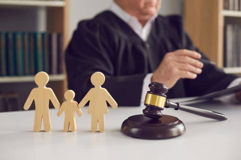 Family Law Concept With Gavel And Wooden Family Figurine